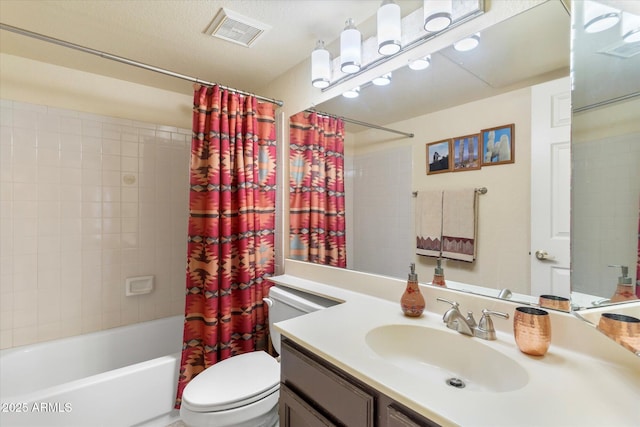 bathroom featuring visible vents, toilet, vanity, and shower / bath combo