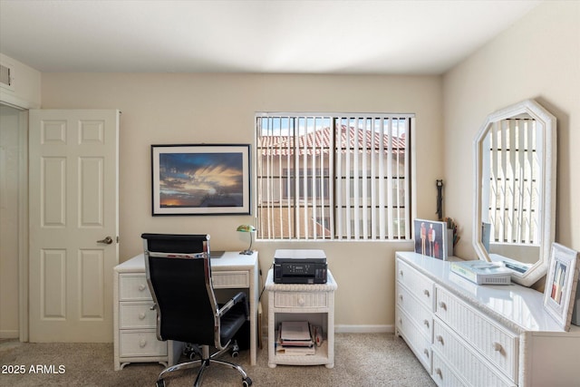 office space with light colored carpet and baseboards