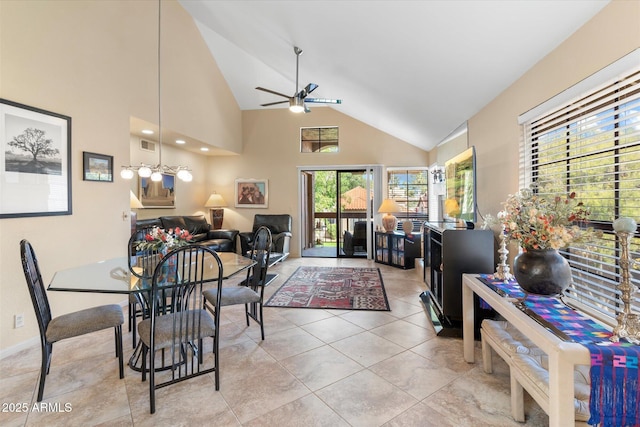 dining room featuring light tile patterned flooring, visible vents, high vaulted ceiling, and a ceiling fan