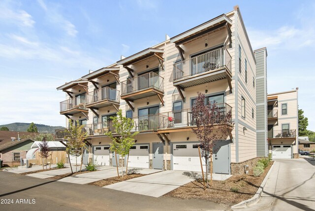 613 N Beaver St Unit 5, Flagstaff, AZ 86001 - view of building exterior with a garage and driveway