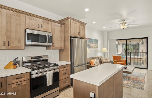 613 N Beaver St Unit 5, Flagstaff, AZ 86001 - kitchen with light wood finished floors, open floor plan, recessed lighting, a ceiling fan, and appliances with stainless steel finishes