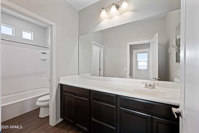 full bathroom featuring vanity, shower / bathing tub combination, toilet, and wood finished floors