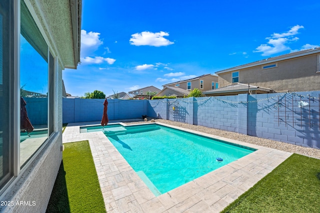 view of pool featuring a fenced in pool, a fenced backyard, and a patio area