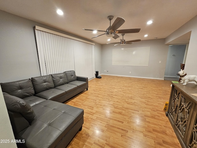 living area with light wood finished floors, baseboards, a ceiling fan, and recessed lighting