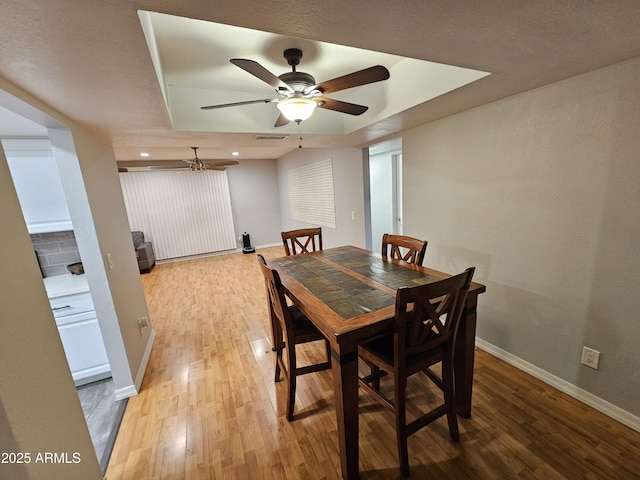 dining space with light wood-style flooring, baseboards, ceiling fan, and recessed lighting