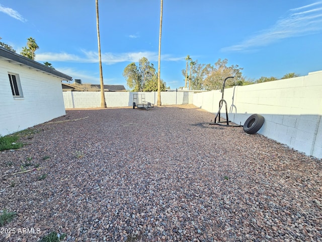 view of yard with a fenced backyard