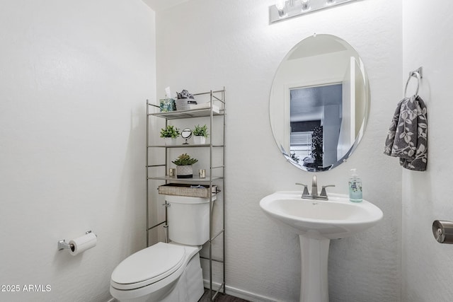 half bath featuring toilet