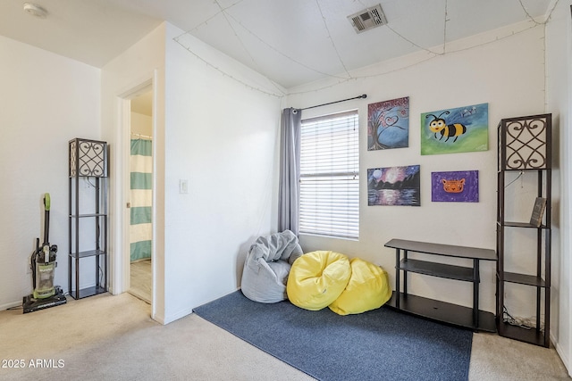 game room featuring carpet, lofted ceiling, and visible vents