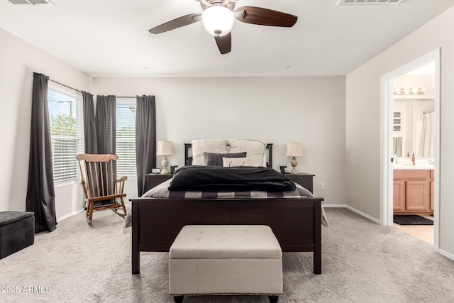 34913 N 30th Dr, Phoenix, AZ 85086 - bedroom featuring light carpet, baseboards, ensuite bathroom, and ceiling fan