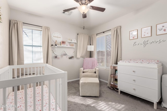 34913 N 30th Dr, Phoenix, AZ 85086 - bedroom featuring a crib, multiple windows, carpet flooring, and baseboards