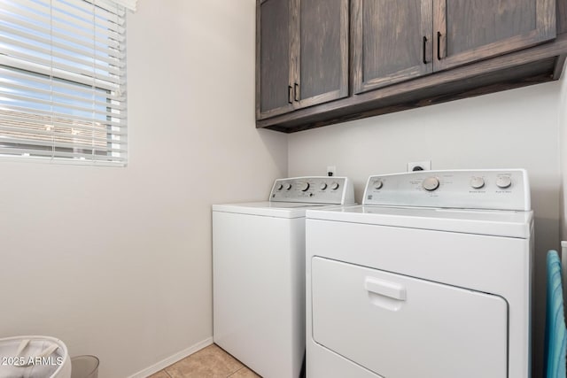 34913 N 30th Dr, Phoenix, AZ 85086 - washroom with cabinet space, washer and dryer, light tile patterned floors, and baseboards