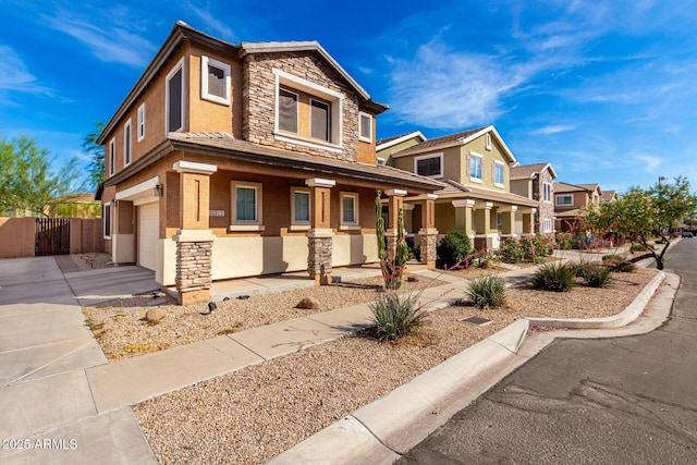 34913 N 30th Dr, Phoenix, AZ 85086 - craftsman-style home with stone siding, covered porch, stucco siding, a garage, and driveway