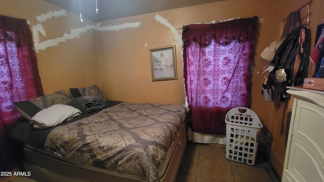 bedroom with light tile patterned flooring