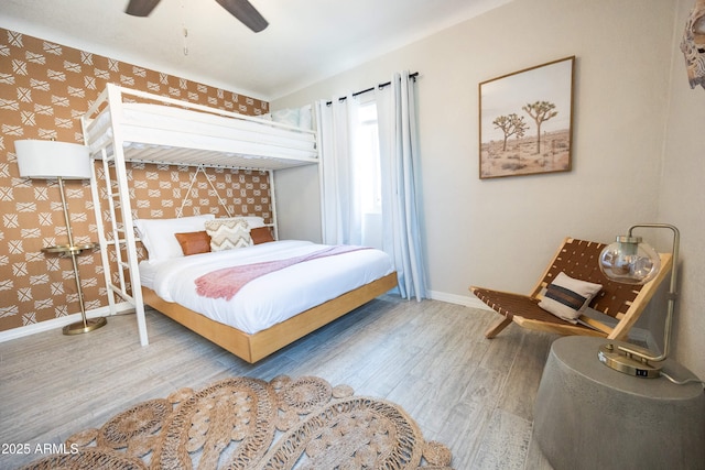 1513 E Sheridan St, Phoenix, AZ 85006 - bedroom with wallpapered walls, baseboards, wood finished floors, and ceiling fan