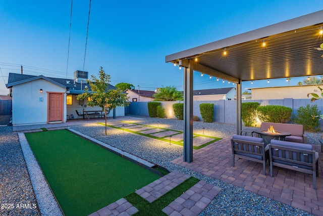 1513 E Sheridan St, Phoenix, AZ 85006 - fenced backyard with an outdoor fire pit, a game area, cooling unit, and a patio area