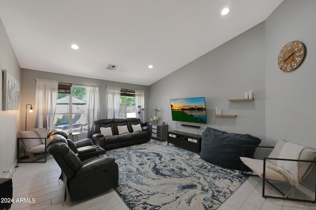 living room with lofted ceiling