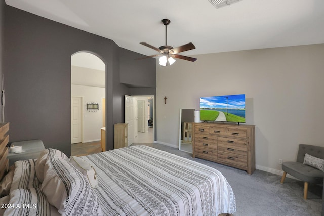 bedroom featuring ceiling fan, carpet floors, and high vaulted ceiling