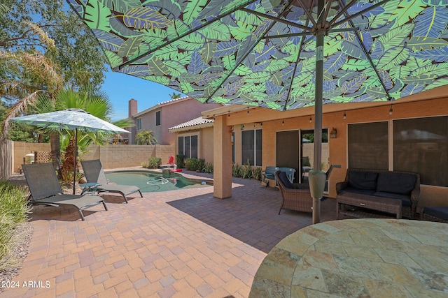 view of patio / terrace featuring outdoor lounge area and a fenced in pool