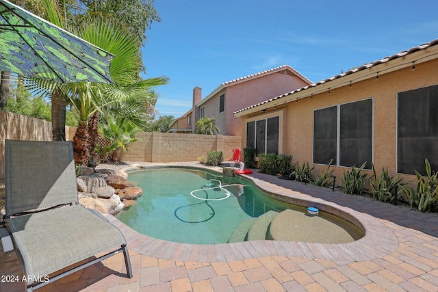 view of swimming pool featuring a patio area