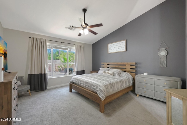 carpeted bedroom featuring vaulted ceiling and ceiling fan