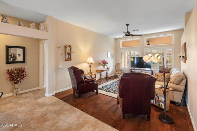 living room with ceiling fan and wood-type flooring