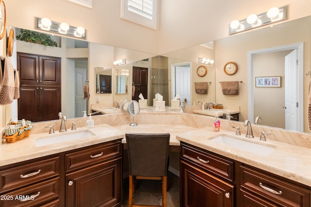 bathroom featuring tile patterned flooring and vanity