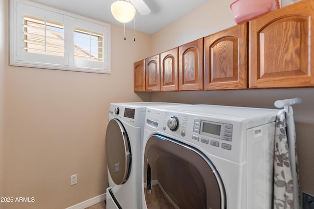 washroom with washer and dryer, ceiling fan, and cabinets