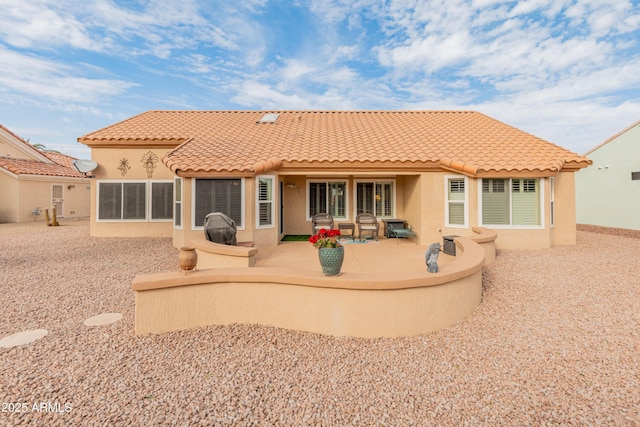 back of house featuring a patio