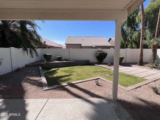 view of yard featuring a fenced backyard and a patio area