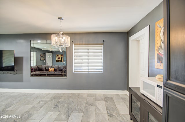 dining space featuring an inviting chandelier