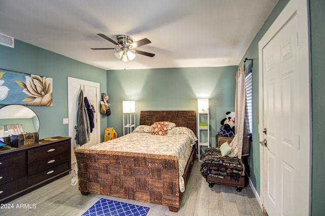 bedroom featuring ceiling fan and light hardwood / wood-style flooring