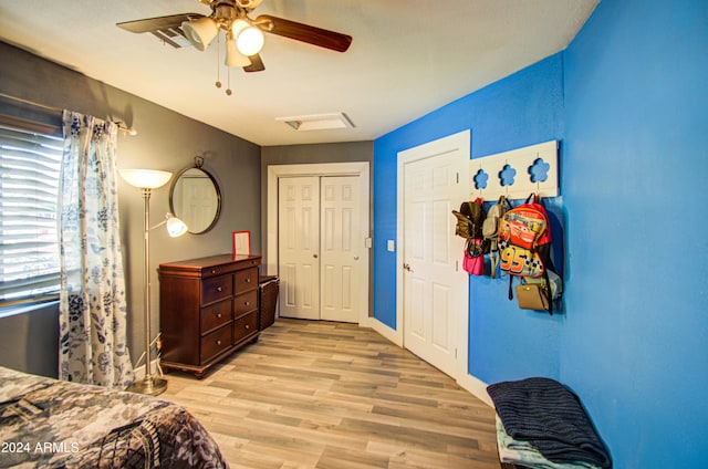 bedroom with light hardwood / wood-style flooring and ceiling fan