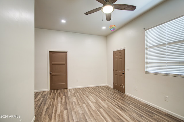 unfurnished room featuring light wood-type flooring and ceiling fan