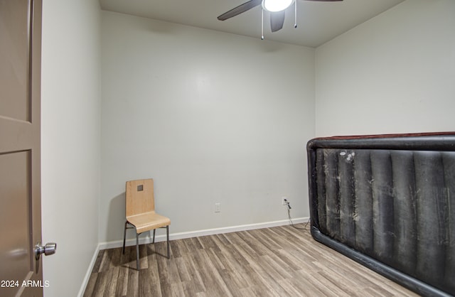 bedroom with light wood-type flooring and ceiling fan