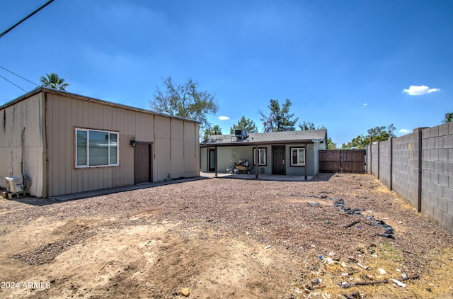 rear view of house featuring a patio area