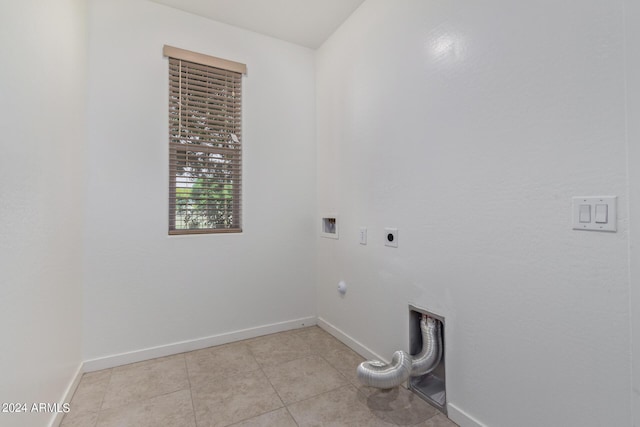 laundry room featuring hookup for an electric dryer, light tile patterned floors, and washer hookup