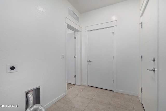 corridor with light tile patterned floors