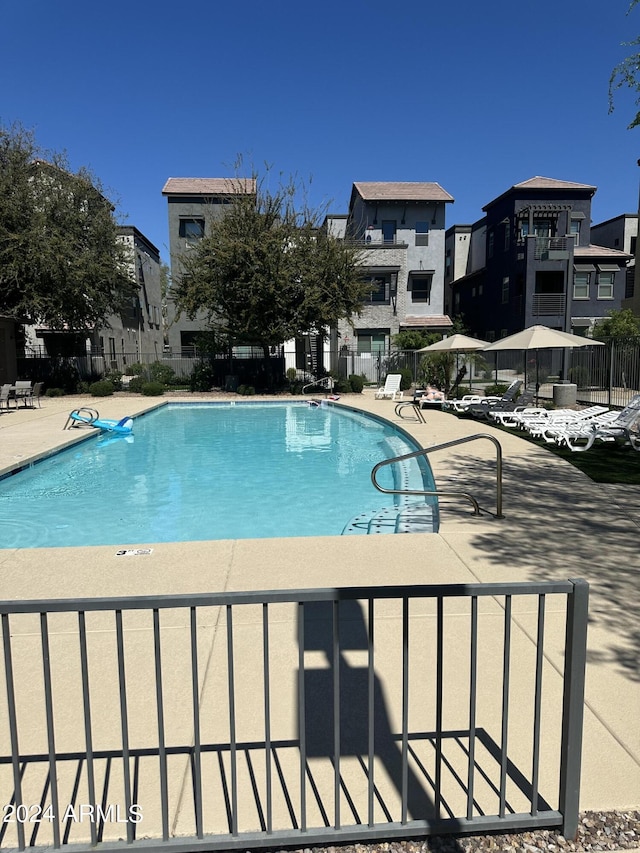 view of swimming pool featuring a patio