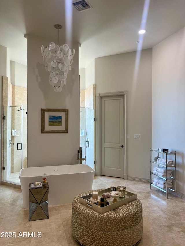 10821 E Troon N Dr, Scottsdale, AZ 85262 - bathroom with a freestanding tub, a shower stall, and a chandelier