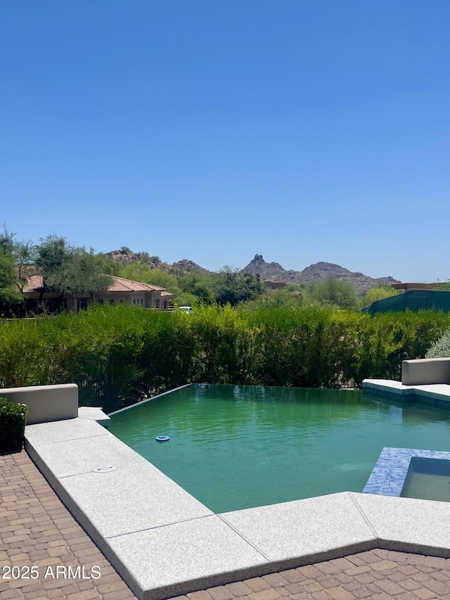 10821 E Troon N Dr, Scottsdale, AZ 85262 - view of pool featuring a mountain view and an infinity pool