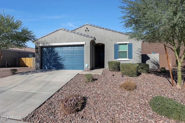 ranch-style home featuring a garage