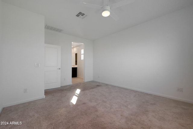 empty room with light carpet and ceiling fan