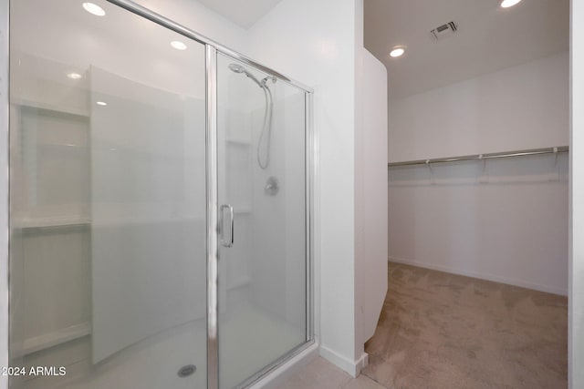 bathroom featuring walk in shower