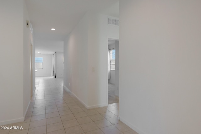 hallway with light tile patterned flooring