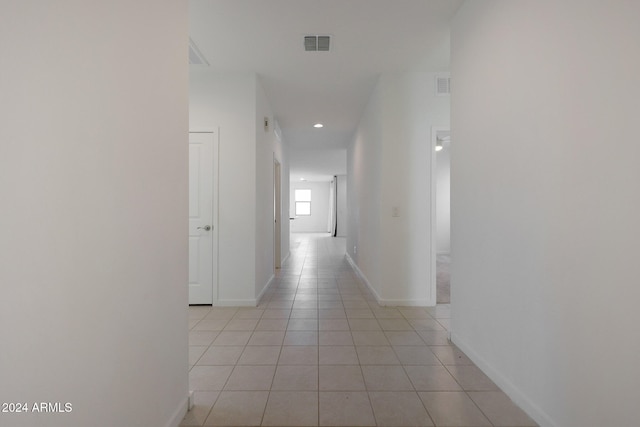 hallway featuring light tile patterned floors