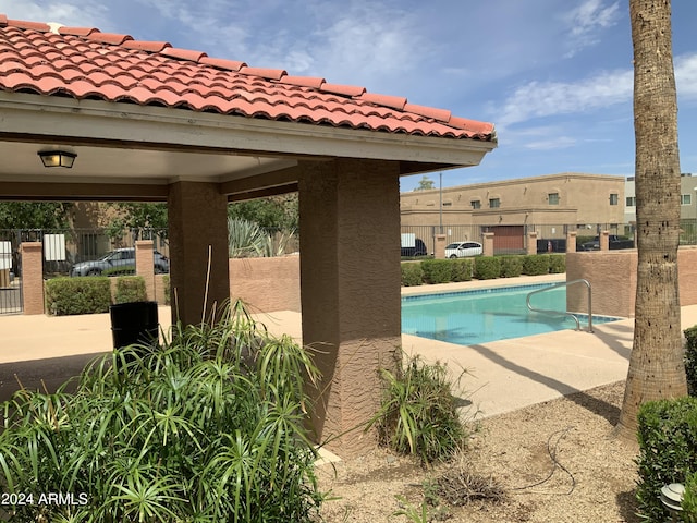 view of swimming pool with a patio area