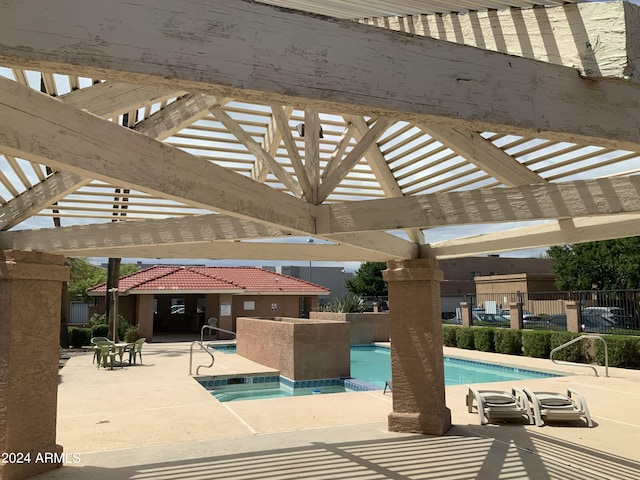 view of swimming pool with a patio