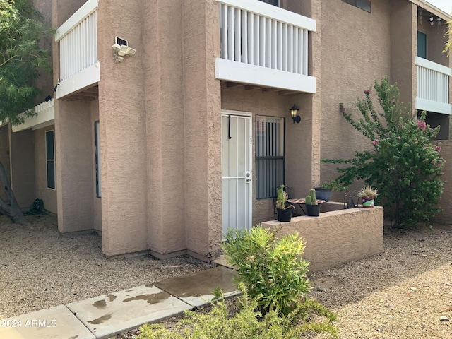 property entrance with a balcony