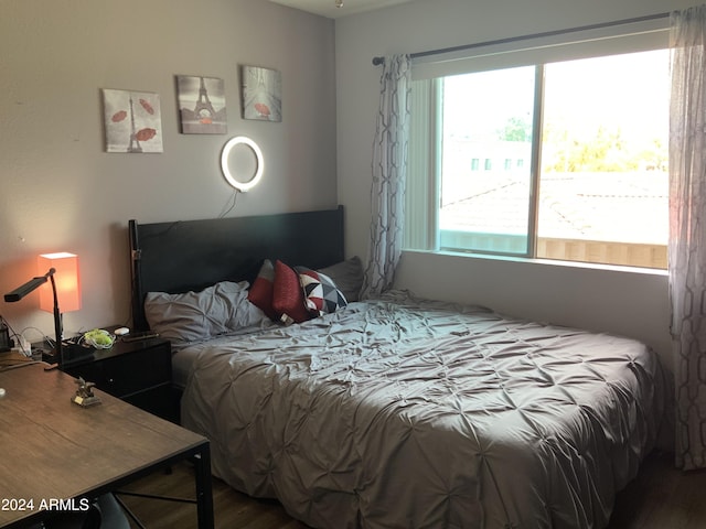 bedroom with hardwood / wood-style floors