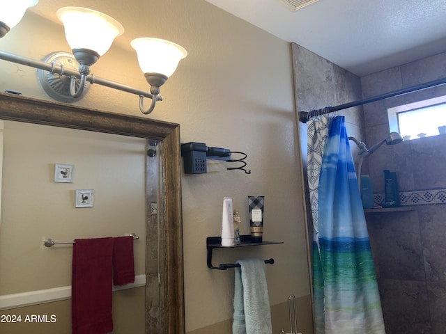 bathroom with a shower with shower curtain